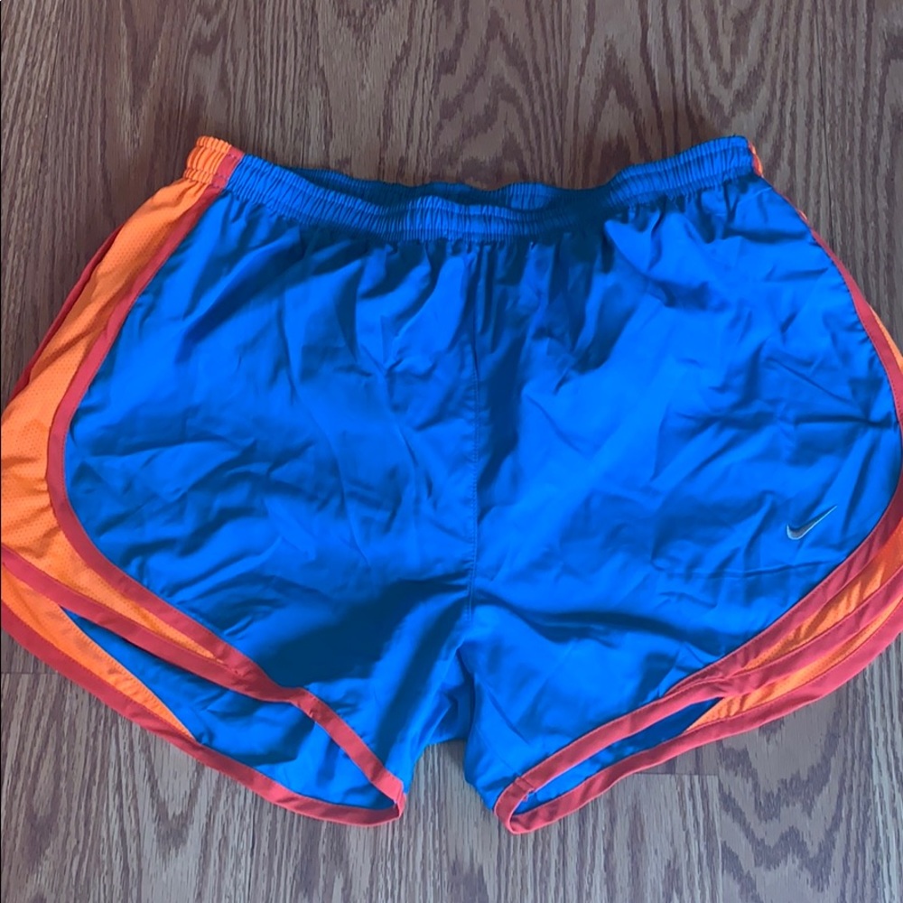 Blue and neon orange w/red nike shorts